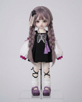 Emberfox BJD doll wearing the pastel goth skeleton pinafore outfit