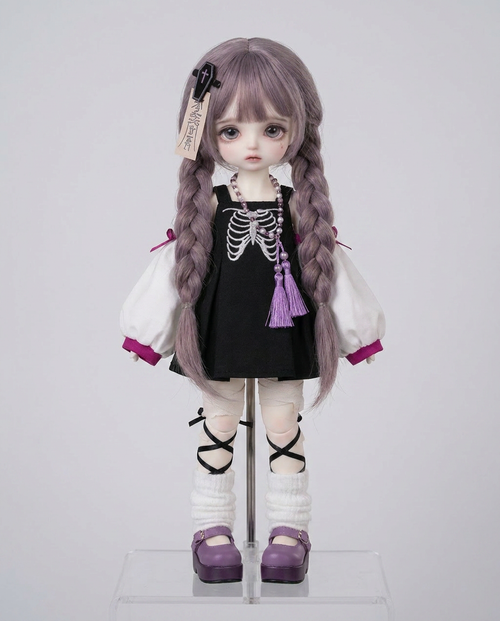 Emberfox BJD doll wearing the pastel goth skeleton pinafore outfit